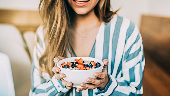patient eating a healthy cereal after receiving diet guidance from Campbell chiropractor